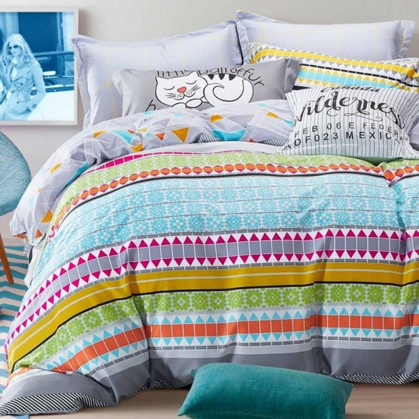 Set of bed sheets and duvet cover with creative prints. Decorative pillows complement. Production under consultation. Illustrative photo.